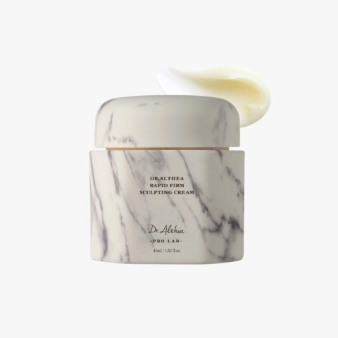 Marble-patterned jar of Dr. Althea Rapid Firm Sculpting Cream with white lid, cream swirled on top behind the lid label shows brand and product name.