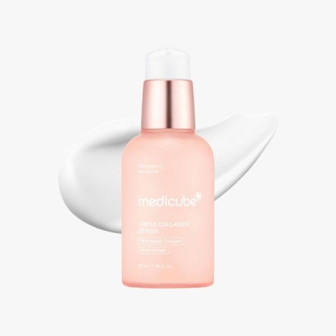 Pink Medicube Triple Collagen Serum bottle with a white-cream swirl in the background, cosmetic product.
