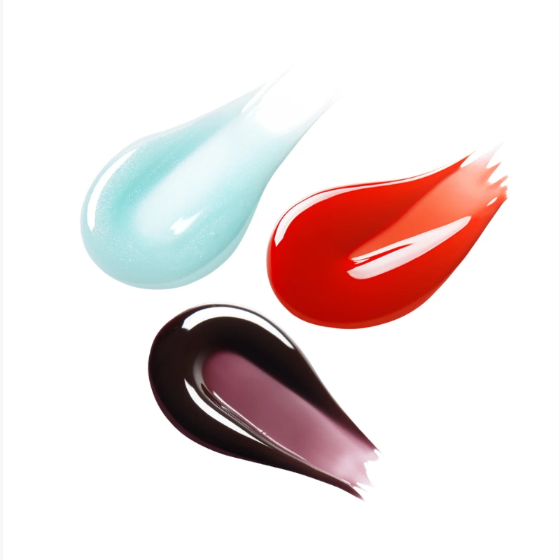 Three paint strokes in blue, red, and dark purple on a white background, suggesting a color palette or painting materials.