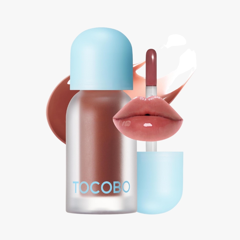 Makeup product duo: a frosted bottle with a light blue cap labeled TOCOBO and a pink lipstick with glossy lips beside it on a pale background, illustrating a cosmetic set.