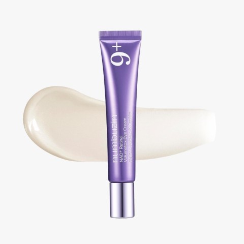 Purple skincare tube with the number 6 on the cap, placed over a beige cream swatch.