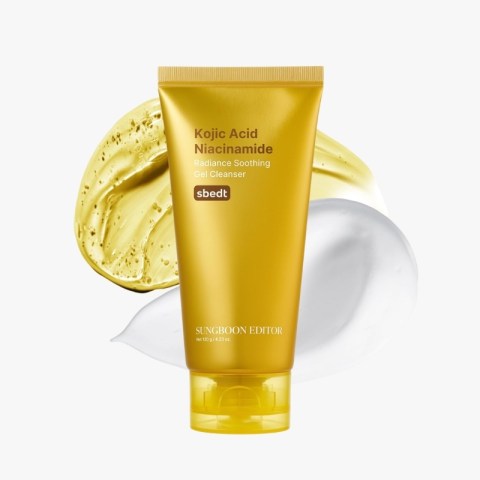 Golden tube of Kojic Acid Niacinamide Radiance Soothing Gel Cleanser against gold and white swirl background (brand name Sungboon Editor).