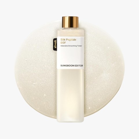 Bottle of Silk Peptide EGF Intensive Smoothing Toner by Sungboon Editor on a round glittery beige backdrop, with a gold cap.