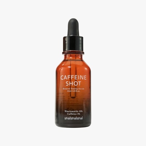Brown glass dropper bottle of skincare serum labeled 'CAFFEINE SHOT' with a black dropper cap (blemish toning serum).